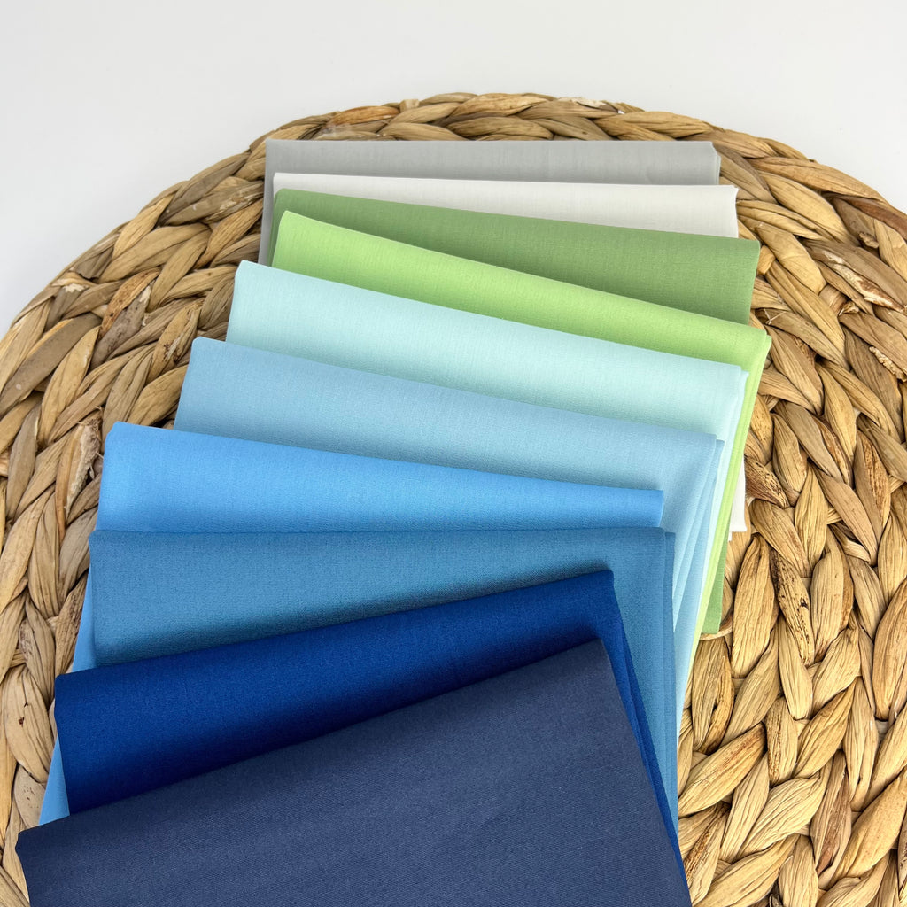 Curated fabric bundle of navy, blue, greens and grays