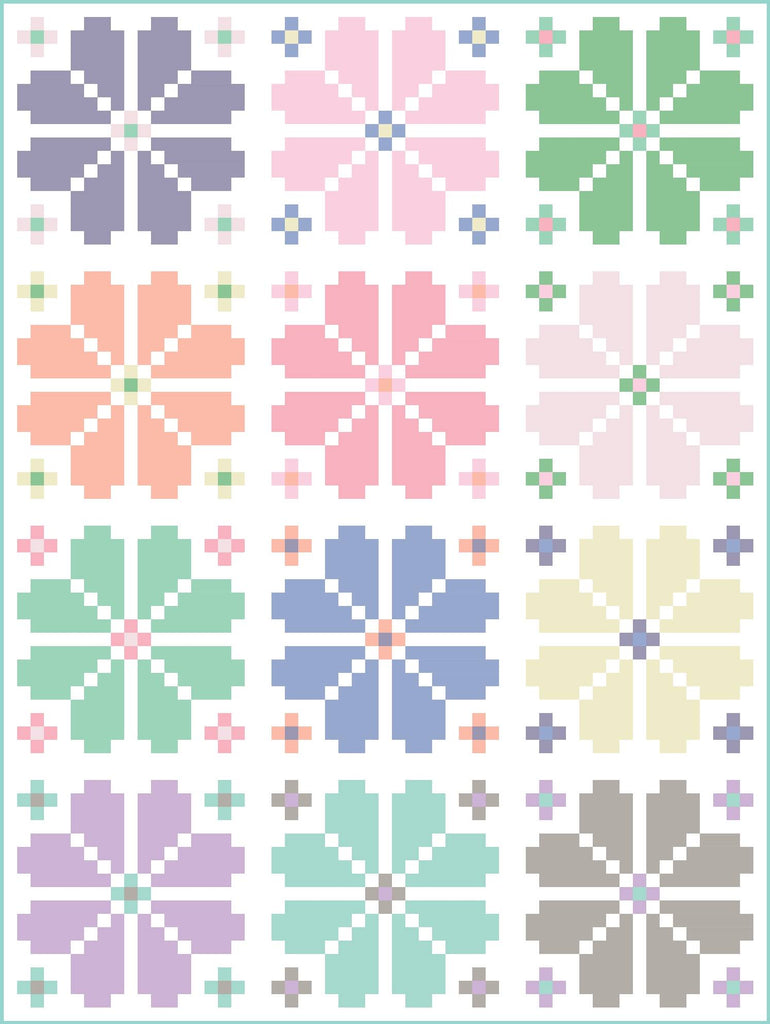 Knitted Blooms throw size quilt kit in pastels on a white background curated by Going Coastal Fabrics | Knitted Blooms quilt pattern designed by Lo & Behold Stitchery