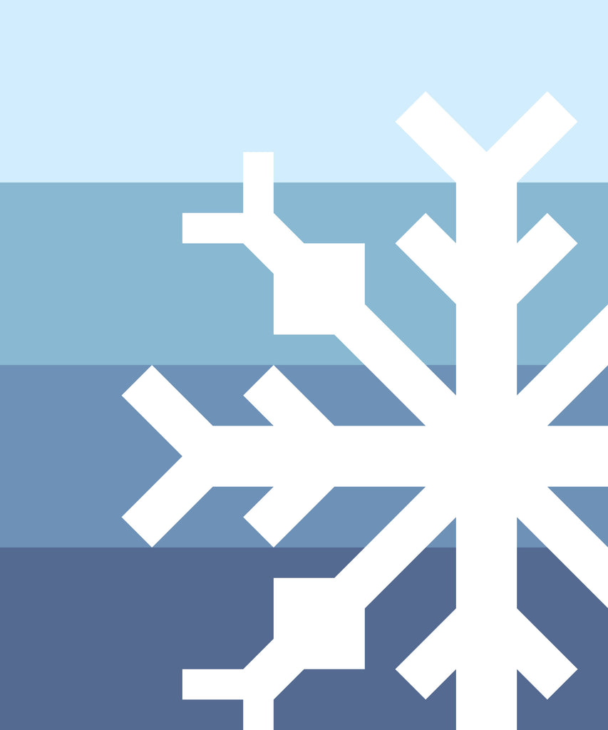White snowflake design on a blue gradient background | Snowflake quilt kit curated by Going Coastal Fabrics | Pattern designed by Modern Handcraft